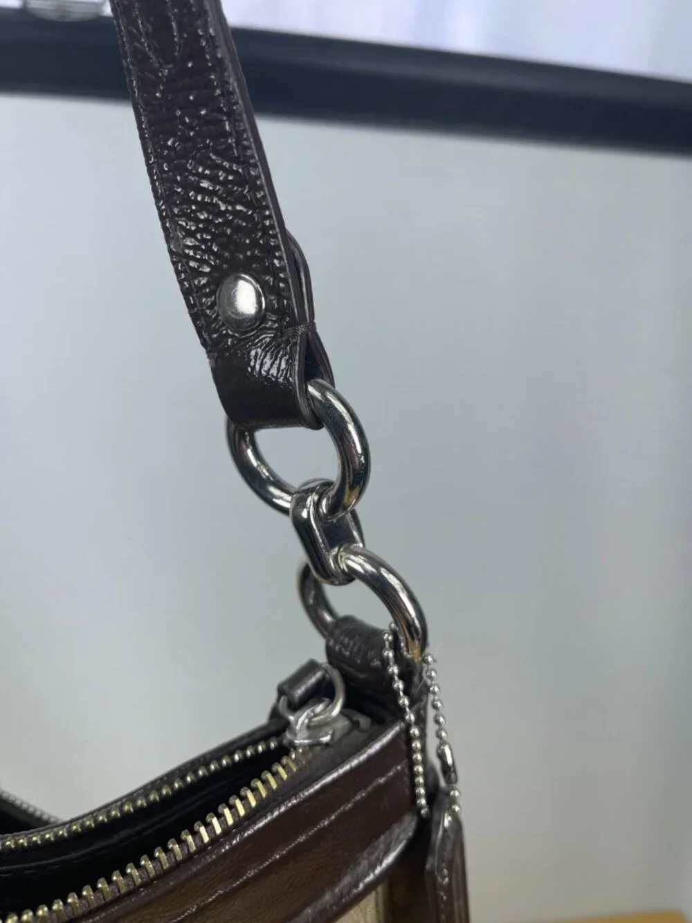 Classic older-era Coach Signature hobo bag featuring jacquard canvas and patent